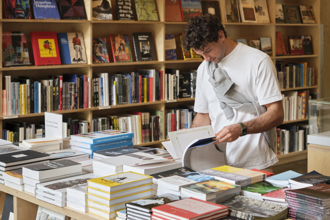 A person browses the books at Dia Beacon Bookshop