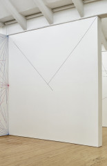 A large drawing featuring two diagonal lines from the top corners joining and forming a trianglular shape covers a wall.